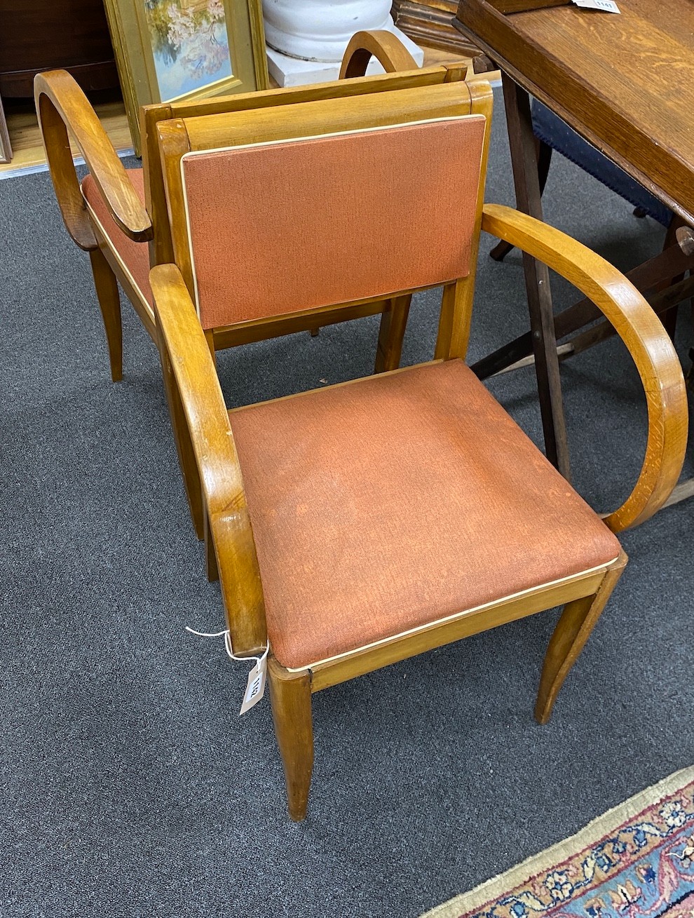 A pair of 1950s French beech Bridge elbow chairs